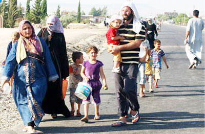 Hàng nghìn người dân Syria tiếp tục lánh nạn trước nguy cơ xảy ra chiến tranh. (Ảnh: aim.org)