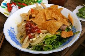 Visiting Hoi An Ancient Town, many tourist like to enjoy Cao lau specialty for their  meals