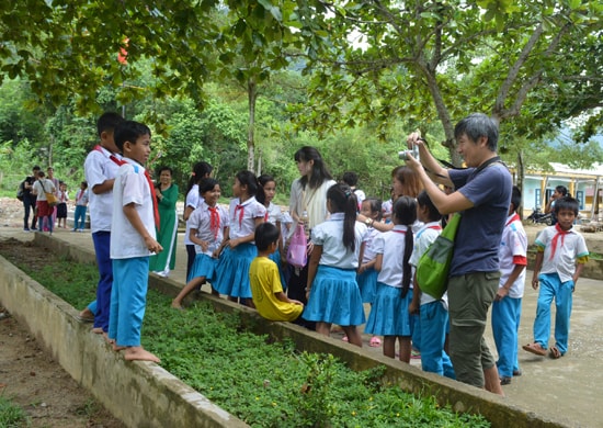 A Japanese tourist in a school in Ta Bhing. 