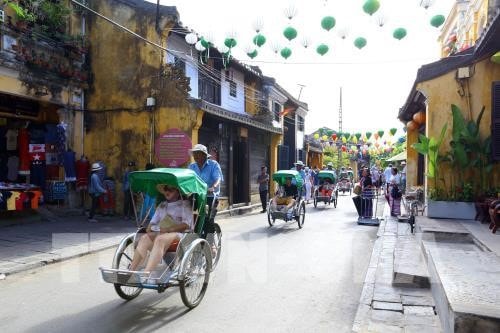 Old houses and roads always attract tourists  to visit the Hoi An ancient town. Photo: Vietnam News Agency