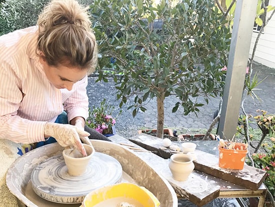 Bree Dawn is making a pottery products in Thanh Ha village