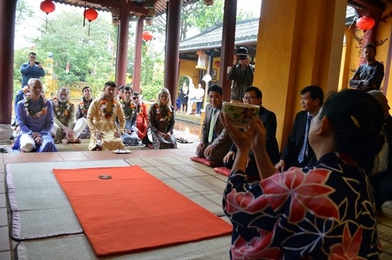 Enjoying tea ceremony at Cam Pho communal house