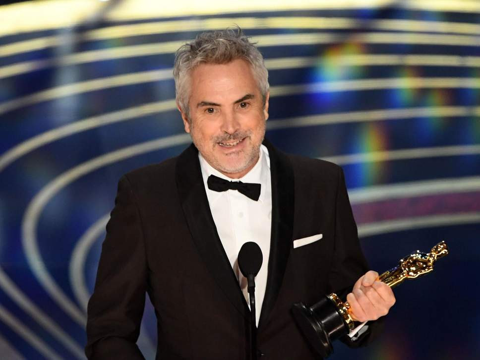 Đạo diễn người Mexico, Alfonso Cuaron nhận giải Đạo diễn xuất sắc nhất. Ảnh: AFP