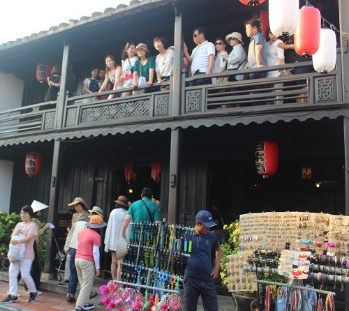 Visitors at an ancient house in Hoi An ancient town.