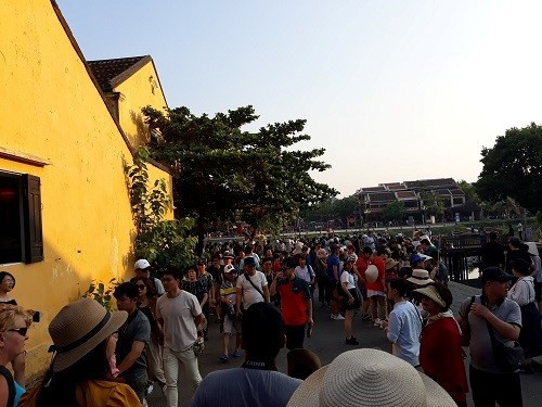 Hoi An ancient quarter is crowded with people.