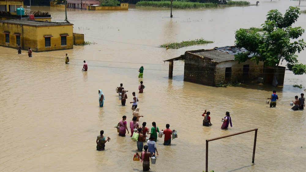 Nước biển dâng, lũ lụt sẽ diễn ra nghiêm trọng hơn. Ảnh: AFP