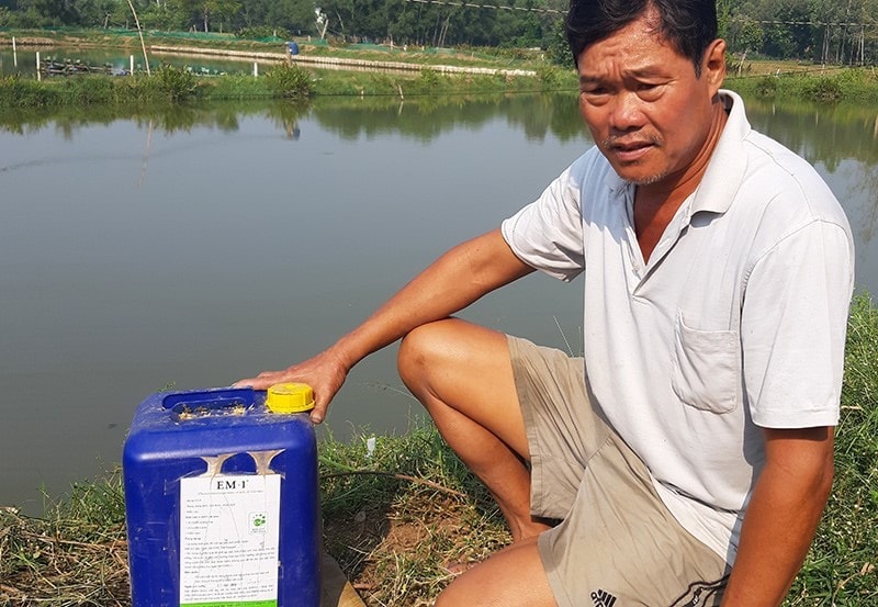 A shrimp farmer beside his bio-product.