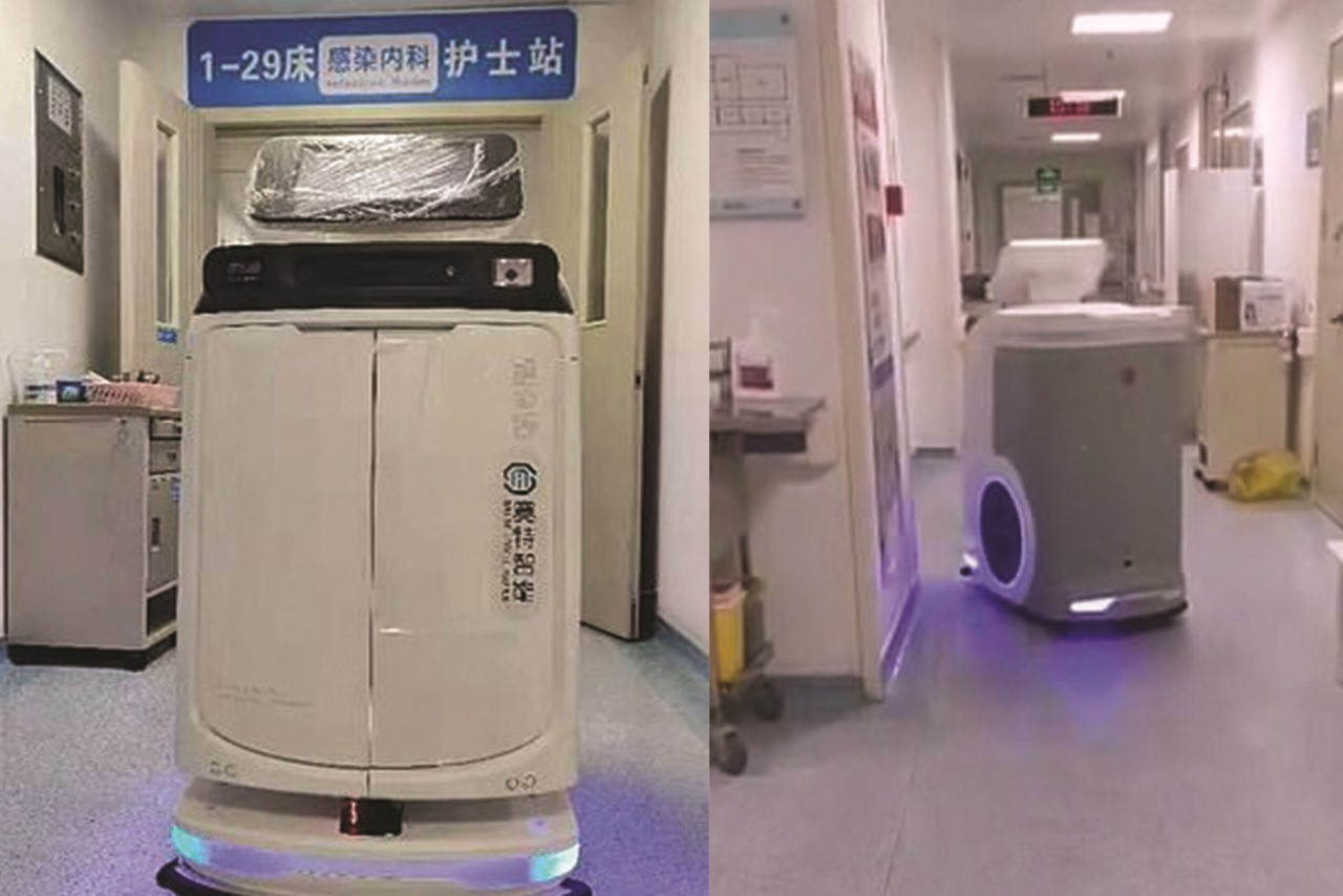 Hai rô bốt phục vụ trong một bệnh viên ở Trung Quốc. Ảnh: dalymail