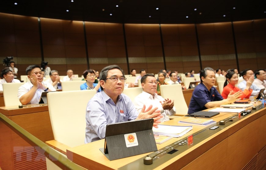  457/457 Đại biểu Quốc hội biểu quyết thông qua Nghị quyết phê chuẩn Hiệp định Thương mại Tự do giữa CHXHCN Việt Nam và Liên minh Châu Âu (EVFTA). (Ảnh: Dương Giang/TTXVN)