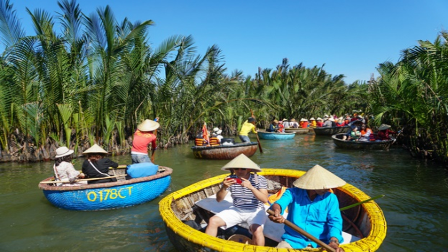 Visitors on coracles in Bay Mau nipa forest