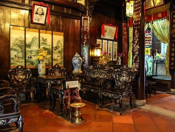 Wooden nacred table and chairs in Tan Ky ancient house. Photo: vanhien.vn