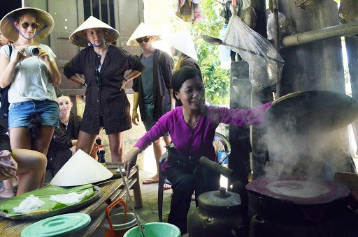 Foreign tourists at a traditional craft village in Quang Nam
