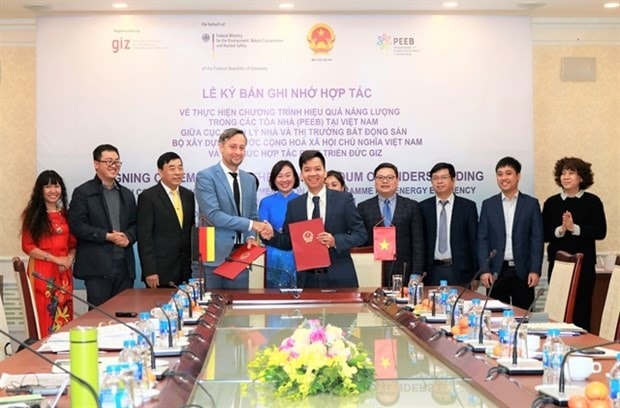 Representatives of the German Development Co-operation-GIZ Vietnam and the Ministry of Construction’s Housing and Real Estate Market Management Bureau (HREM) sign a Memorandum of Understanding (MoU). — Photo courtesy GIZ-Vietnam