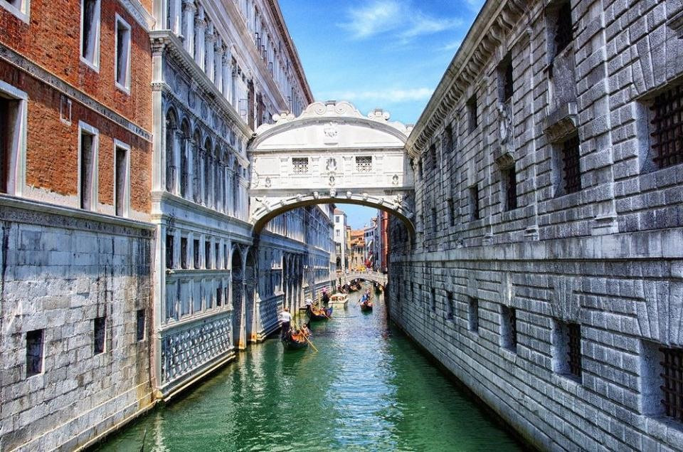 Sospiri Bridge (or the Bridge of Sighs) is a bridge in Venice, Italy. The enclosed bridge is made of white limestone, has windows with stone bars