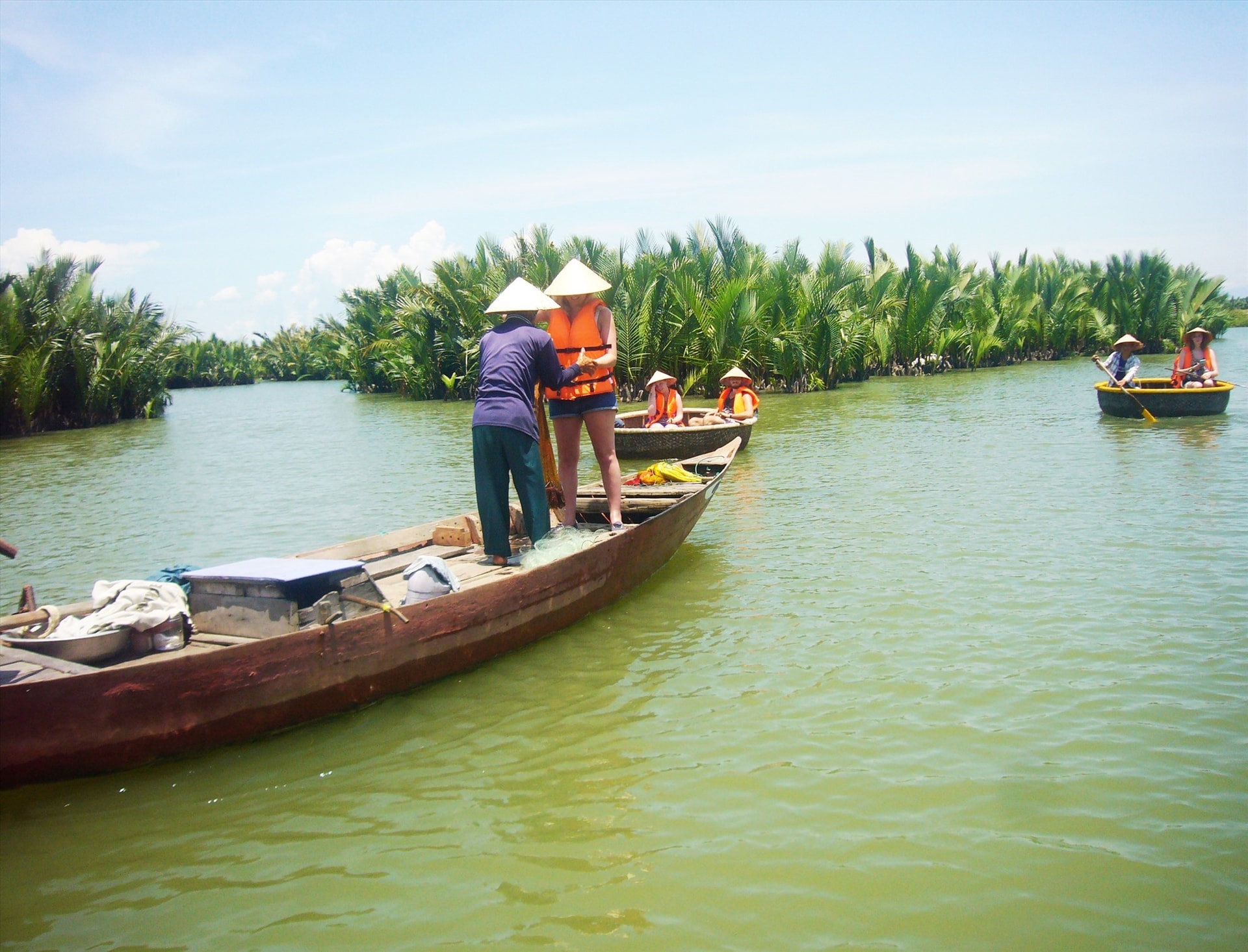 Visitors to Cam Thanh nipa palm forest