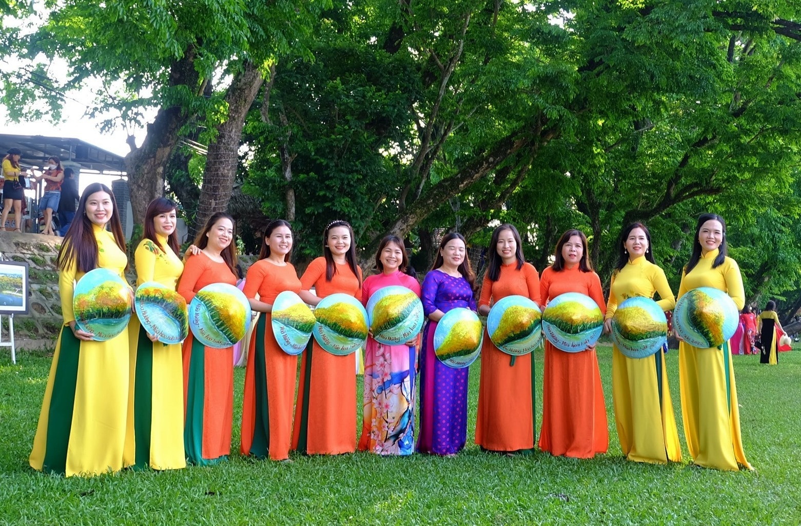 Colours of Ao dai under padauk canopy