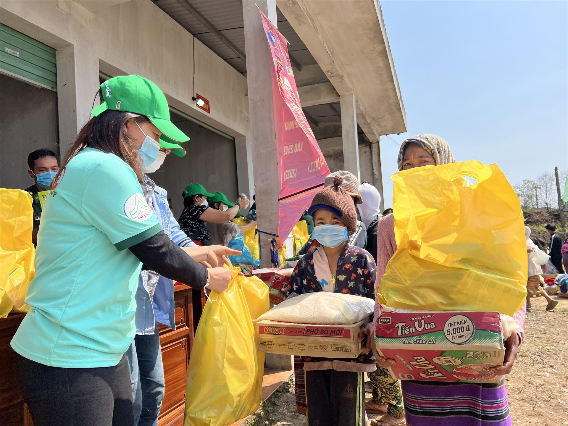 Laotian people receive essential commodities.