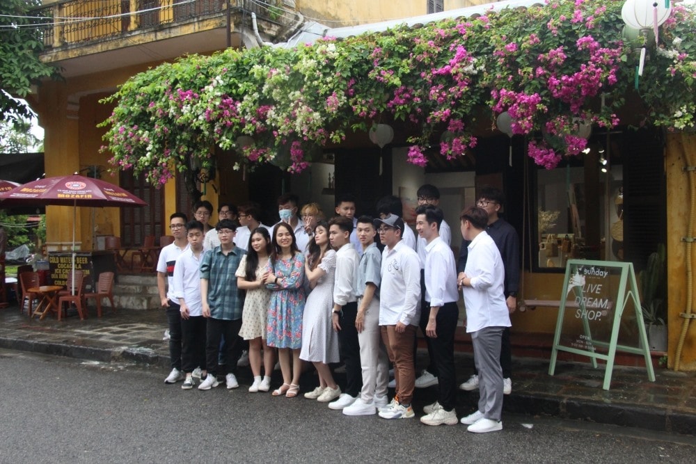 Taking photos in front of an ancient house