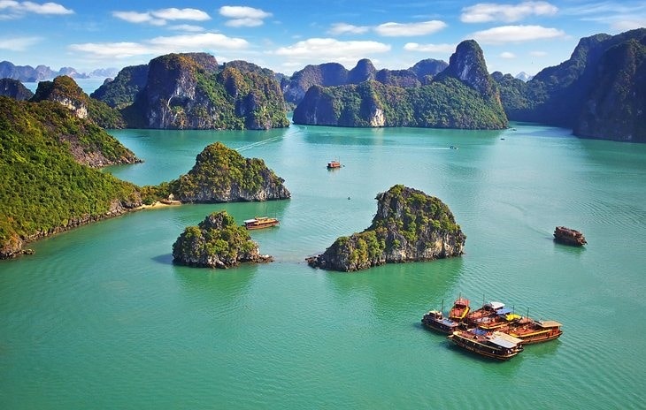 The karst seascape of Halong Bay is one of the best places to visit in the world for spellbinding sea views and is a UNESCO World Heritage Site. Thousands of limestone islands sit within this bay in the Gulf of Tonkin, eroded into jagged pinnacles by wind and water action over millennia.