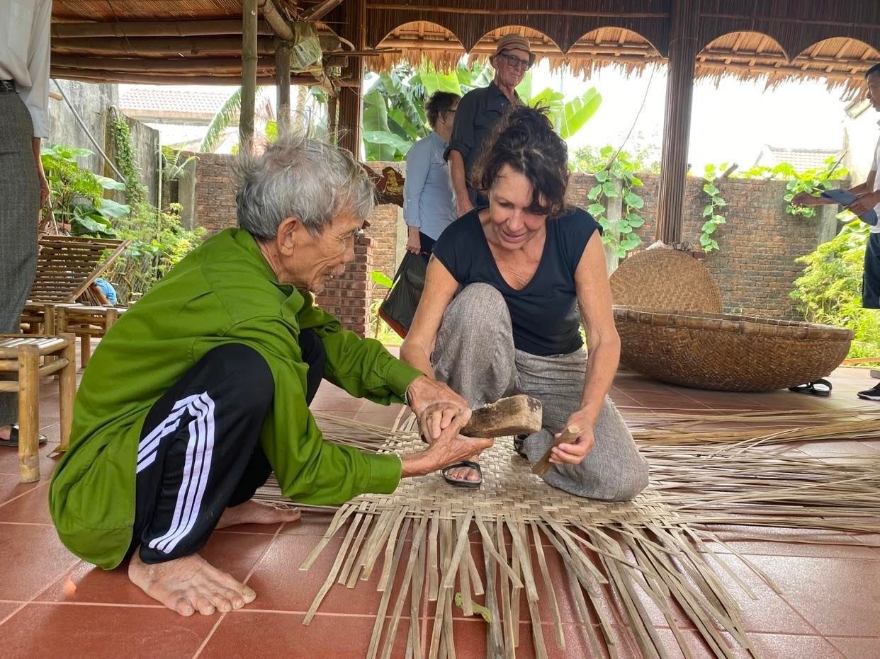 Mr. Ban and a foreigner learning how to do wicker