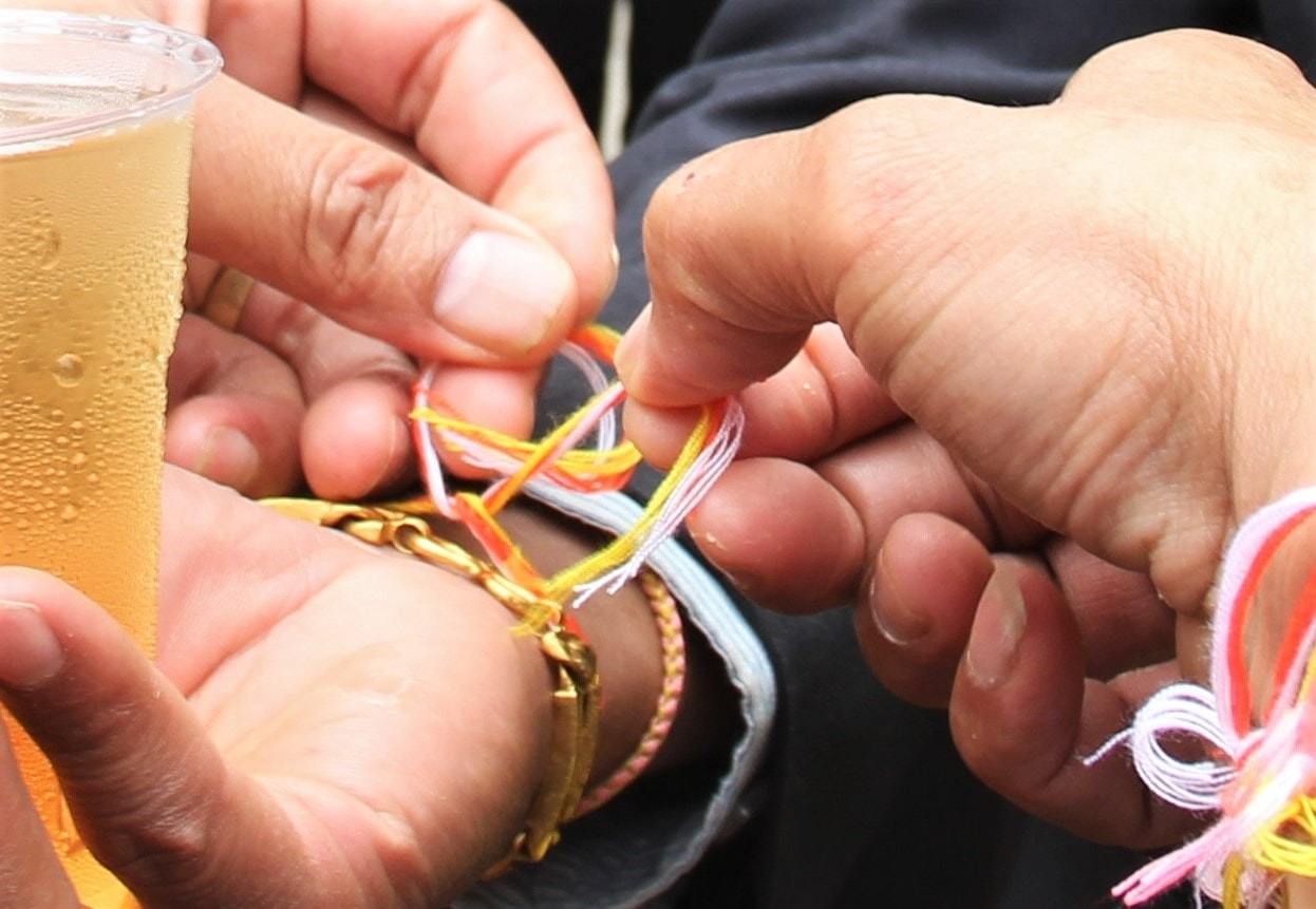 Lucky threads on people’ wrists