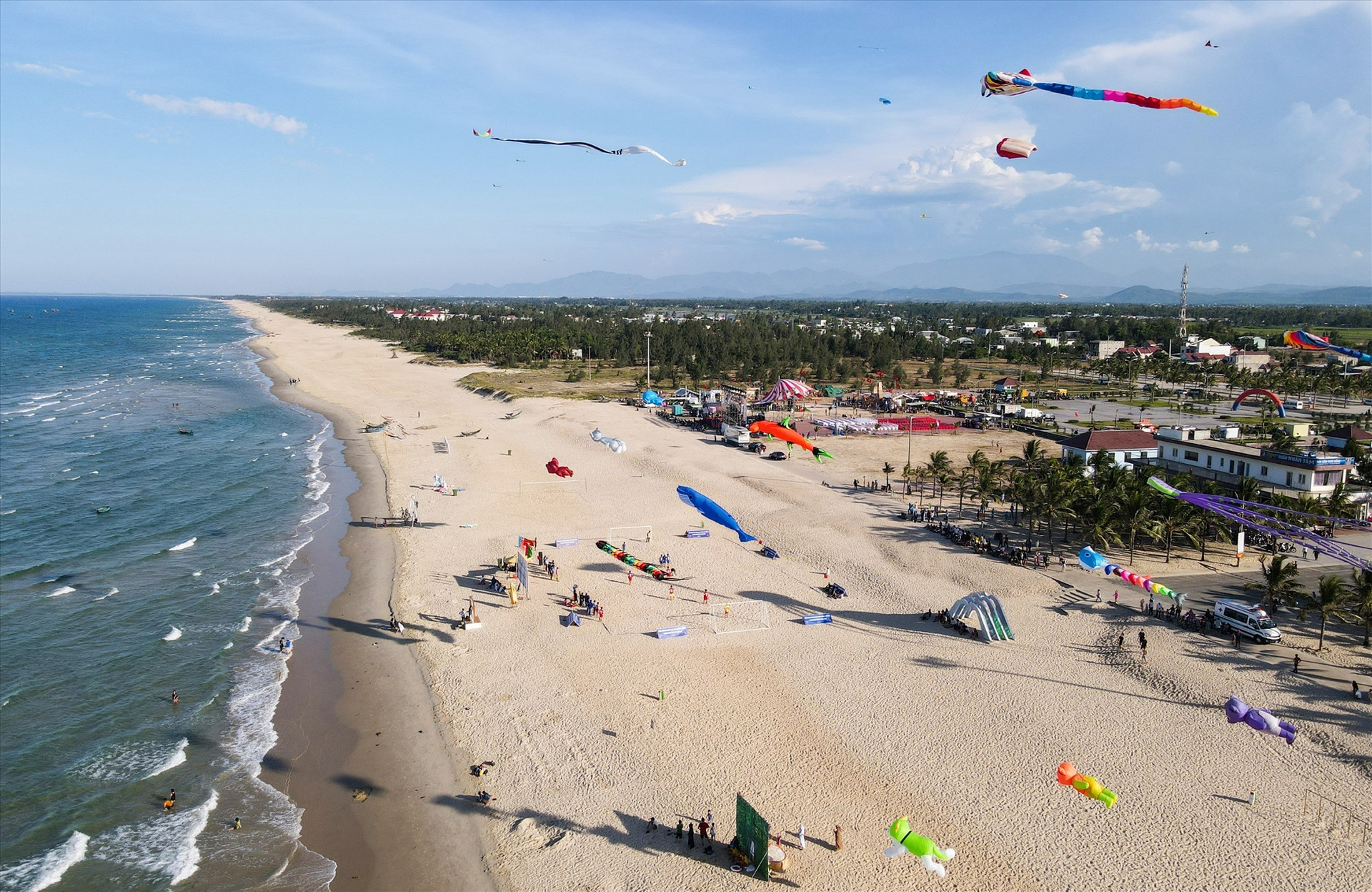 Colourful kites flying in the sky of Tam Thanh beach