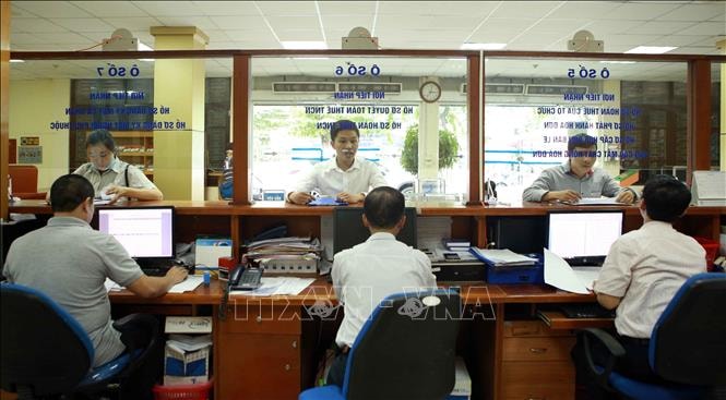 Tổng số tiền thuế nợ ngành thuế quản lý ước tính đến cuối tháng 7-2023 là 151.325 tỷ đồng. Ảnh minh họa: TTXVN