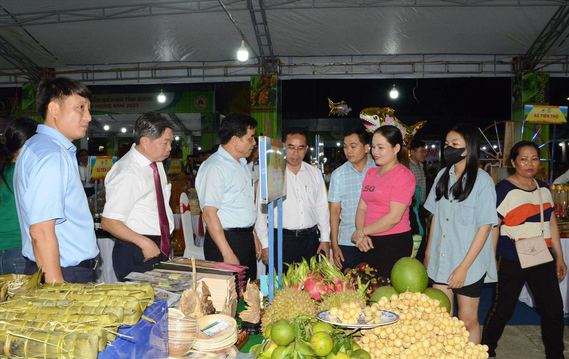 Various agricultural products such as durians, mangosteens, yogurt with black sticky rice are displayed and sold at the fair.