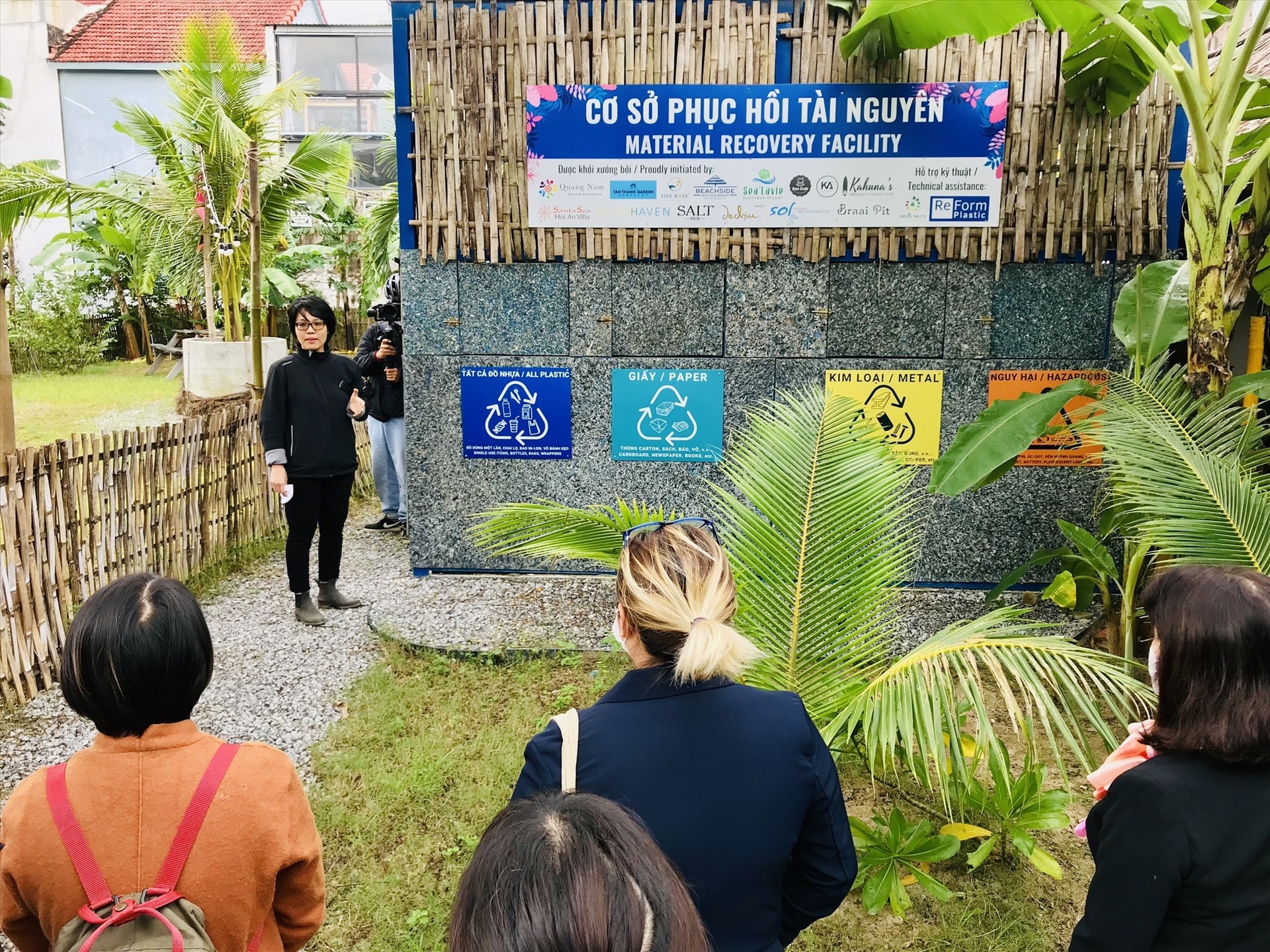 Visitors learning about the material recovery facility in Tan Thanh fishing village