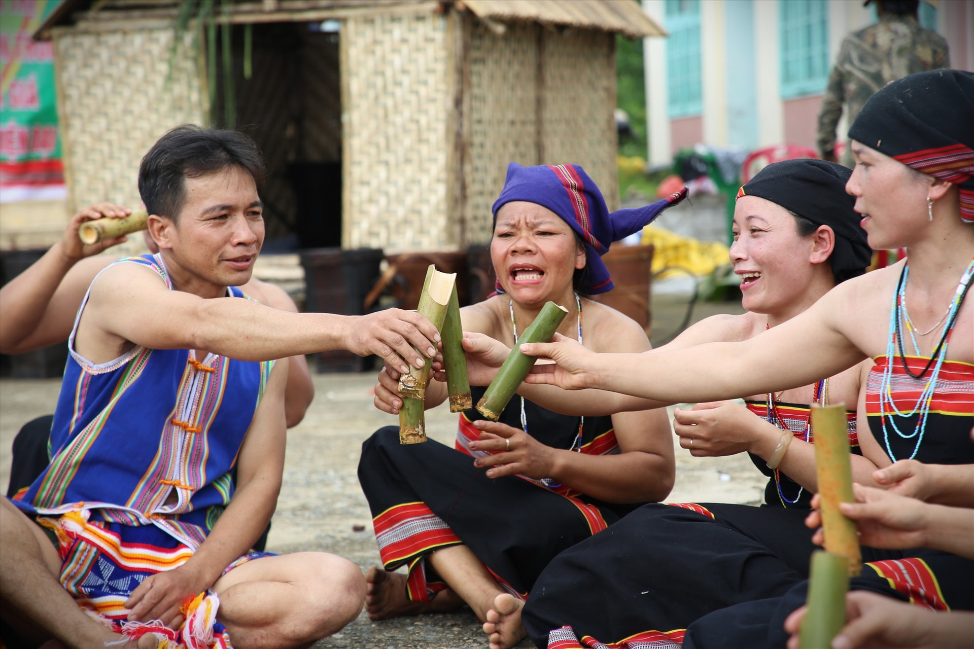 They share a toast of rice wine to celebrate the new rice harvest.