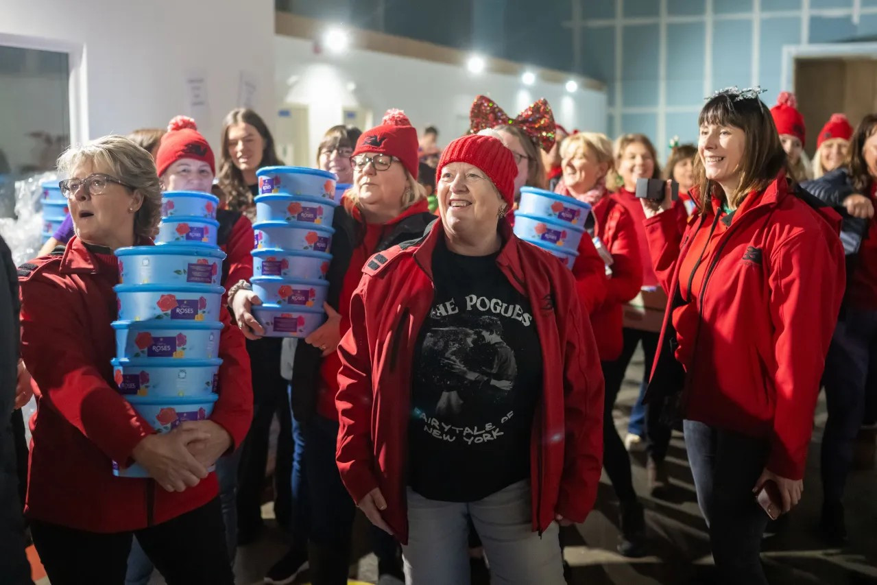 Volunteers help pack hampers at the “Everyone Deserves a Christmas” campaign on Dec. 21, 2023, in Swansea, Wales. (Matthew Horwood/Getty Images)