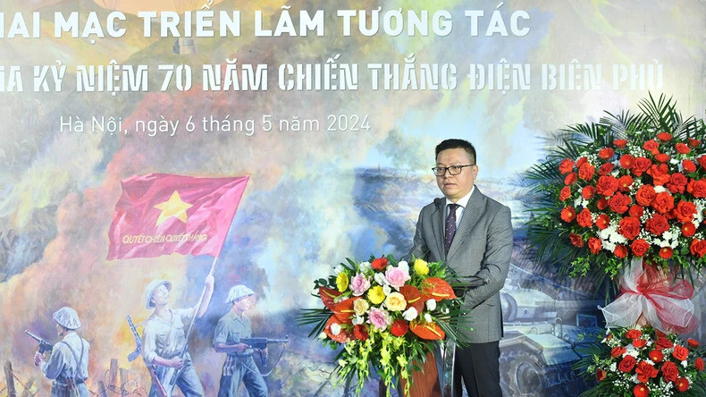 Tổng Biên tập Báo Nhân Dân - Lê Quốc Minh phát biểu tại lễ khai mạc triển lãm. Ảnh: Báo Nhân Dân