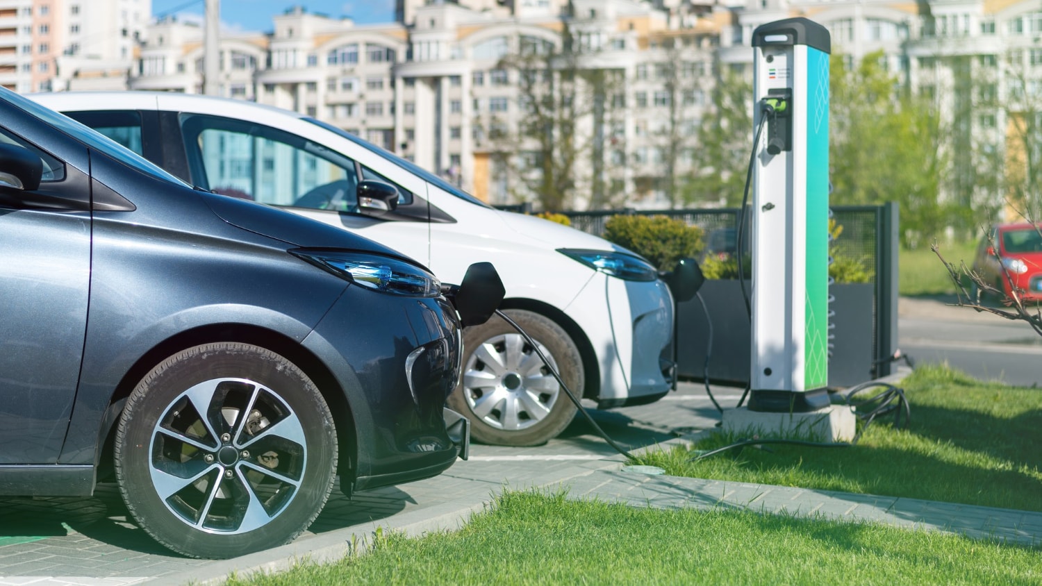 two-charging-electric-cars-charge-station-city.jpg