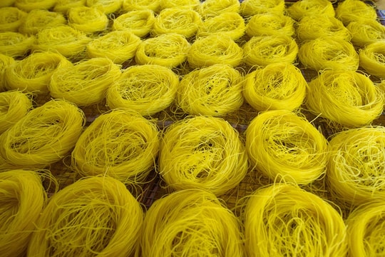 Handmade dried rice noodles remain a livelihood for rural Vietnamese families